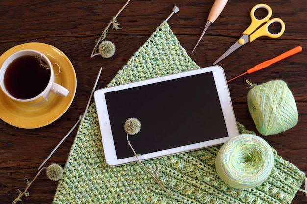 contact desk with embroidery sample and phone